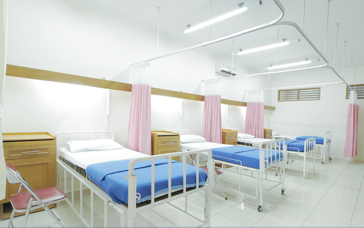 Clean hospital ward with patient beds